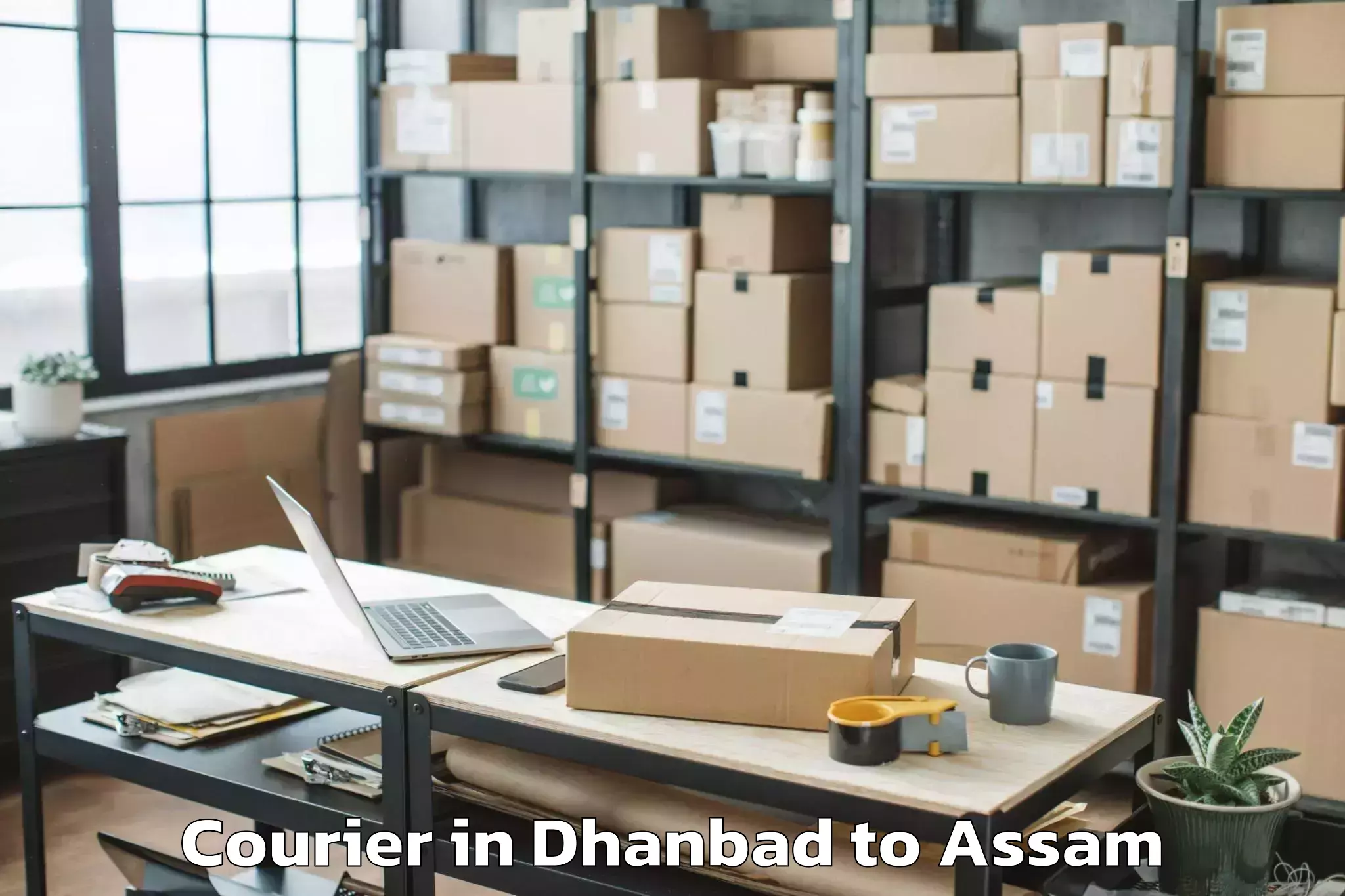 Easy Dhanbad to Laharighat Courier Booking